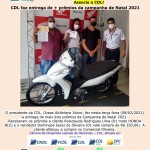 2022.02.08 - entrega moto biz, prêmio campannha natal 2021 para cliente comercial oliveira